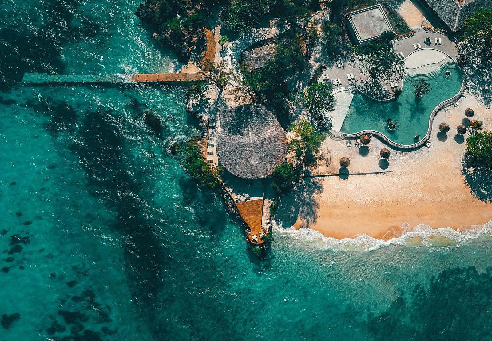 Boutique high-end private luxury beach villa with private pool facing the blue ocean