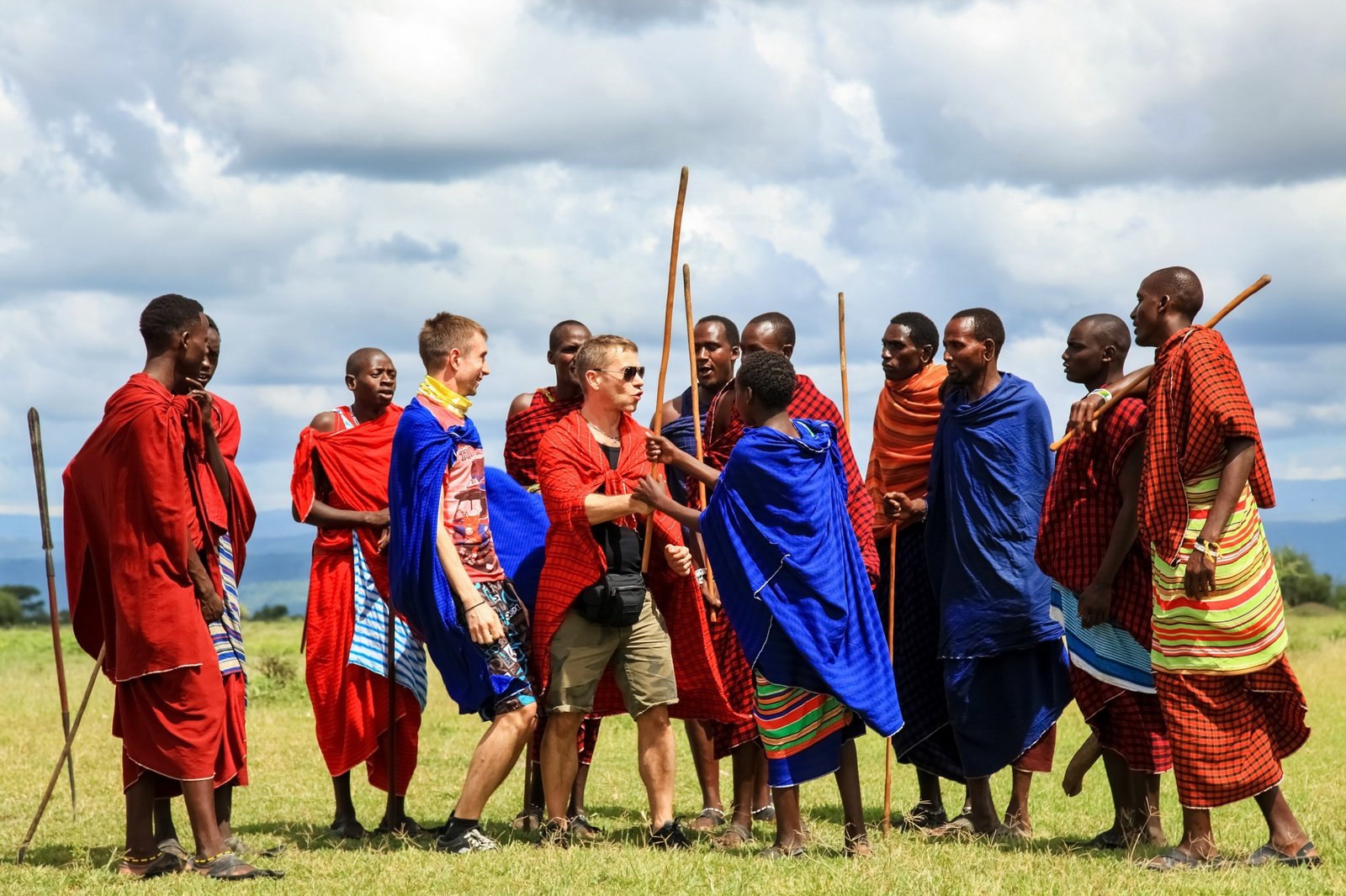 Traditional mud-and-thatch circular Maasai houses enclosed by a protective outer thorn-bush perimeter hedge