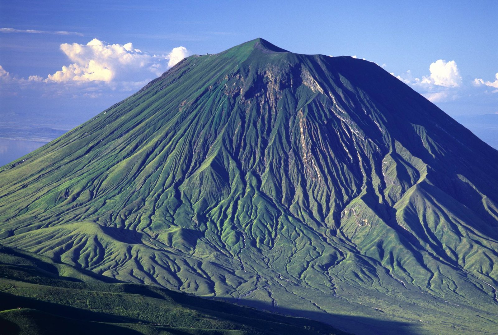 Dramatic steep volcanic crater ridges of Ol Doinyo Lengai volcano near Lake Natron