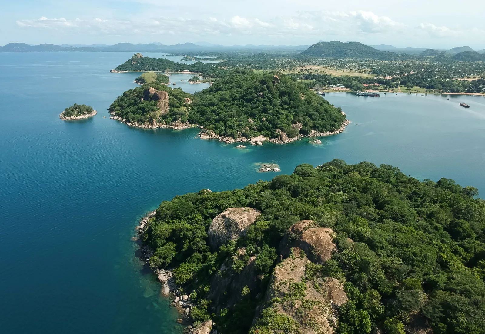Beautiful white sand beach of Mahale Mountains meeting the clear water of Lake Tanganyika
